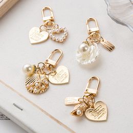 Ins styles Shell Pearl Metal Keychain Creative Small Gifts Jewelry Pearl Bag Sweet Airpods Ornaments Ladies Fashion Accessories