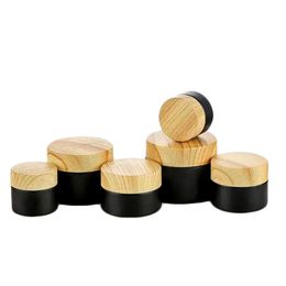empty cosmetic jars 15g NZ - 5g 10g 15g 20g 30g 50g Black Frosted Glass Jar Cream Bottle Empty Cosmetic Jars Packing Container with Plastic Wood Grain Cover