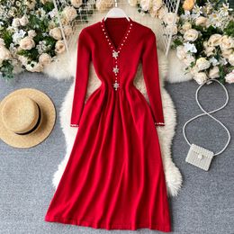 Women French Retro Knitted Dress V Neck Pearl Button Long Sleeve A-line Dress Autumn Winter Elegant Solid Sweater Dress 210419