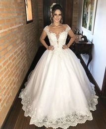 2022 Luxury Pearls Beaded A Line Wedding Dresses Bridal Gowns Buttons Back Lace Appliques Illusion Backless Spring Summer Bride Dress Vestidos De Novia Plus Size