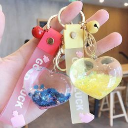 Creative Acrylic Into Quicksand Oil Bottle Love Heart Key chain Flash Peach for Women Car Keychain Bag Pendant G1019