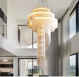 Post-modern duplex building large chandelier empty living room villa golden tassel spiral staircase light