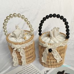 fashion pearls handle rattan women handbags ladies bow wicker woven small tote summer beach straw bag Handmade