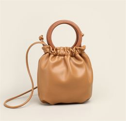 Ring wooden handle handbag casual soft leather fold bucket bag new shoulder messenger Crossbody female bags