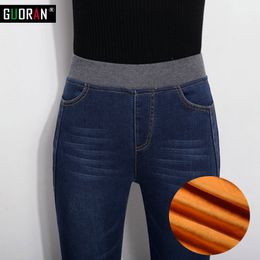 Women's winter warm fleece high elastic waist jeans Female skinny stretch denim pencil pants Plus size buttons long trousers 210519