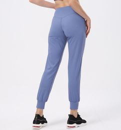 Leggings femininas Yoga Joggers Moda casual Corrida Fitness Calças esportivas Cor sólida Capris Elástico Cintura alta Ajuste solto Roupas de ginástica