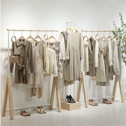 Clothing store display rack women's cloth shop hanging Organisation shoe bag racks landing against the wall clothes Storage Holders white