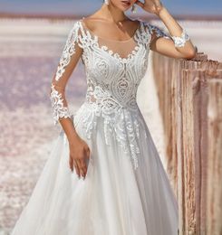 2021 Elegant White Wedding Gowns A Line 3/4 Long Sleeve Lace Appliqued Backless Sweep Train Bridal Dresses Robe De Mariée