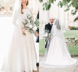 Plus elegant blygsam storlek enkel en linje bröllopsklänning brudklänningar långa ärmar juvel hals stor båge golvlängd satin formella klänningar kläder vestidos de noiva es