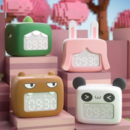 The newest desk clocks, the cute USB charging cartoon desktop children bedroom bedside fun and sleeping electronic clock