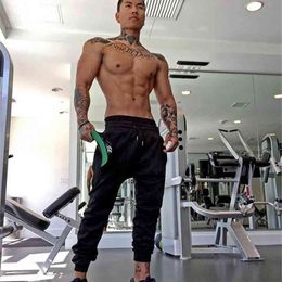 Spring Fashion Mens Joggers Pencil Harem Pants Mens Soild gyms clothing Bodybuilding muscle guys cotton fitness sweatpants 210421