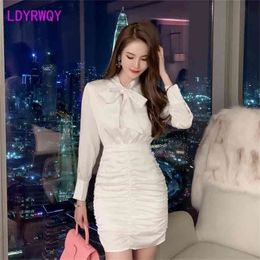 Fall white bow slim pleated long sleeve V-neck dress Office Lady Knee-Length Sheath 210416