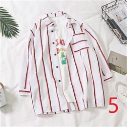 Summer dress vertical stripes 7 seven-sleeve shirt men's trend short-sleeved male students handsome wild jacket 210420