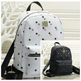 Leather Handbags High Quality 2 size men and women School Backpack famous Rivet printing Backpack Designer lady Bags Boy and Girl 2960