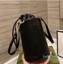 Retro saddle buckle Drawstring bucket bag Women's fashion handbag Designer alphabet canvas purse leather shoulder strap2022