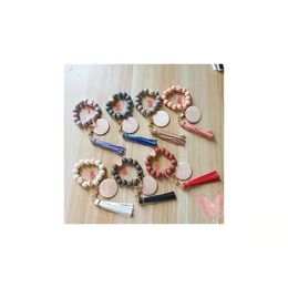Foreign trade wholesale carved pattern wooden bead keychain blank disc PU leather tassel bracelet