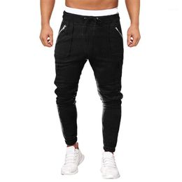 Calça masculina camuflagem homens hip hop harém joggers masculino calças de cordão masculino mensal de bolso sólido de bolso de bolso