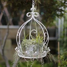Idyllic wrought iron basket flower pot hanging swing potted flowers and green plants by garden decoration 220722
