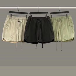 2022ss Pantalones cortos para hombre Pantalones casuales con estampado de letras con bucles sueltos y pantalones cortos reflectantes de hip-hop para mujer de verano
