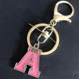 greek accessories Canada - Keychains 1Pcs Various Sorority Skee Pink Lady Keychain OKC002 DIY Greek Bag Accessory Key Ring Accept CustomKeychains