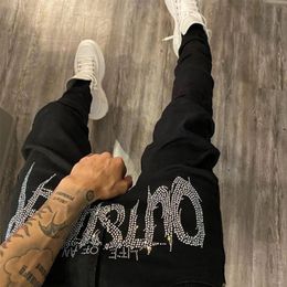 Mens Jeans luxury Designer Black Ripped Fashionable Streetwear with Cozy Skinny Design Rhinestone Embellishments Stretch Fit and Soft Washed Denim Material EXYB