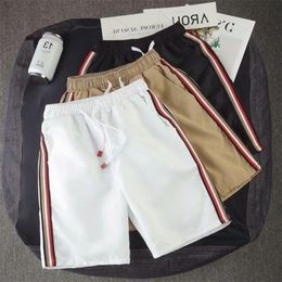 New Men Shorts Casual Solid Colour Stripe Side Summer Male Loose Beach Shorts Elastic Waist Quickdrying Jogger Short Pants T200718