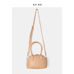 Bag female 2021 new Korean version messenger bag texture shaping Pu women's versatile foreign style hand small square L