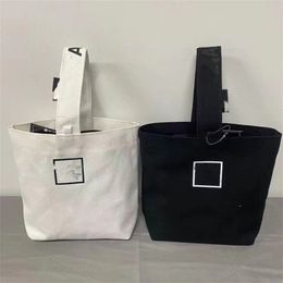 高品質の高級デザインキャンバスオープン化粧品バッグ黒と白のカラーガールメイクアップ Tracvel バッグ最低価格