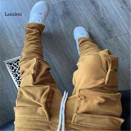 Pantaloni da carico di grandi dimensioni Streetwear Streetwear Pants Long Step Pants Solid Color Tagche tridimensionali Slim pannelli caldi Maschio G220713