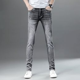 2022 new smoke gray jeans men's Korean version elastic slim men's casual pencil pants popular trendy brand
