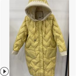 The medium and long women's white duck down down jacket is casual loose fashionable and contrasting color with a hood 201214