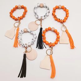 Foreign trade wholesale beaded wooden bead bracelet keychain Personalised wood chip tassel pendant key ring multi-color optional