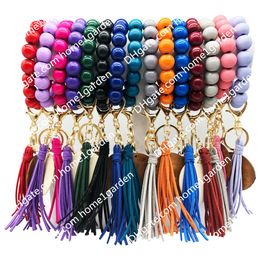 Solid Colour Wooden Bead Keychain with Dark Wood Discs Leather Tassels