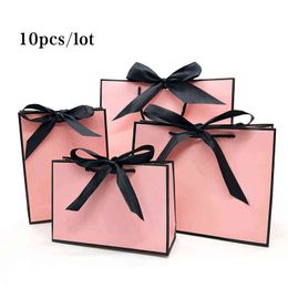 pink paper gift bags wholesale Australia - Pretty Pink Kraft Gift Bag Gold Present Box For Pajamas Clothes Books Packaging Gold Handle Paper Box Bags Kraft Paper Gift Bag AA220318