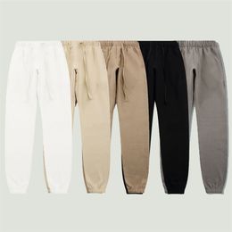 Calça masculina marca de streetwear letra de moletom impressa masculino hip hop solto de cor sólida cor de algodão casual e elástico Casais de calça 220826