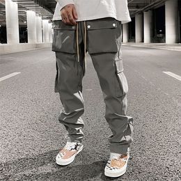High Street Multipocket Casual Trousers for Men and Women Side Breasted Drawstring Cargo Pants Harajuku Solid Loose Pants 220621