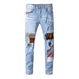 High street fashion jeans light blue embroidered leopard patch elastic slim fit small foot hole gradient jeans
