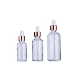 Wholesale clear serum glass dropper bottles with rose gold lid for essential