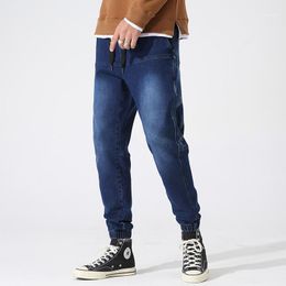 Jeans da uomo Primavera Autunno Nero Blu Cargo Uomo Stretched Denim Jogger Pantaloni Baggy Harem Jean Pantaloni Plus Size 6XL 7XL 8XL