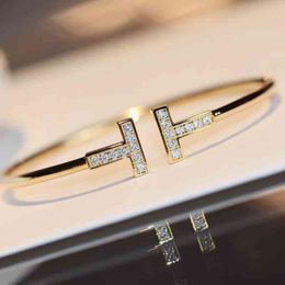 -17mc Classic Fashion Double t Home Hand eingelegt mit hohem Kohlenstoffdiamant gegen Gold CNC Präzisions -Goldbeschichtung hochwertiges elastisches Armband