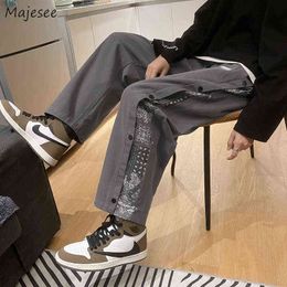 Pantaloni casual da uomo Design con pannelli Stampa Streetwear Pantaloni cargo all-match Baggy stile coreano Pantaloni eleganti Hombre Tooling Chic G220507