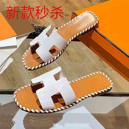 holiday grapes Canada - Designer Herme Slippers Grape mother woven sandals summer new leather tourist holiday beach shoes leisure flat bottomed outer wearing h