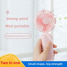 Summer new handheld fan USB charging portable mini fan foldable handheld desktop placed dual-purpose electric fans lithium battery large capacity