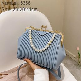 Wholesale ladies leathers shoulder bags sweet little fresh pearl shell bag in summer This year's popular embossed leather handbag Joker simple striped handbags