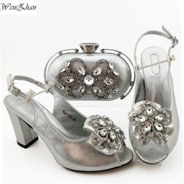 silver grey shoes and matching bolsa