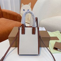 Дизайнеры роскоши высококачественные классические сумки сумки Новые простые винтажные бежевые холст сплайдированный коричневый кожа вертикальные женские сумки сумки