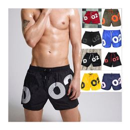 Designers de 20SS shorts masculinos nadam cal￧as curtas Cartas de ver￣o Impresso Ternos de nata￧￣o soltos femininos fitness executando cal￧as de praia de secagem r￡pida