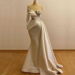 Fabulous Mermaid Prom Dresses See Through Jewel Neckline Beaded Evening Gowns With Long Sleeves Sweep Train Satin Formal Dress