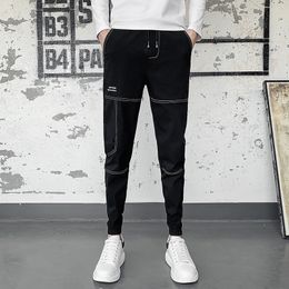 Moda Autumn Button Design Casual Black Harem Pantaloni da uomo Abbigliamento Semplice Slim Fit Streetwear Hip Hop Joggers Pantaloni 36-28 220330