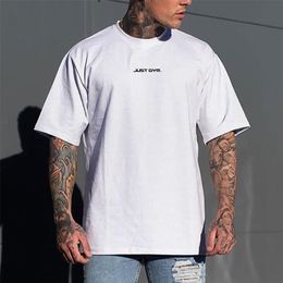 Muscleguys Gym Clothing Mesh Fitness Mens Oversized T Shirt Outdoor Hip Hop Streetwear Loose Half Sleeve Bodybuilding Tshirt 220621